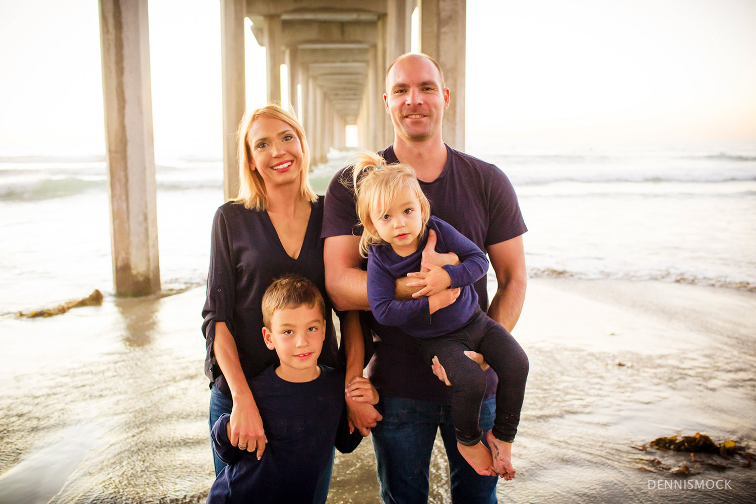 family portraits at La Jolla scripps pier enjoying the sunset and make in sand castles