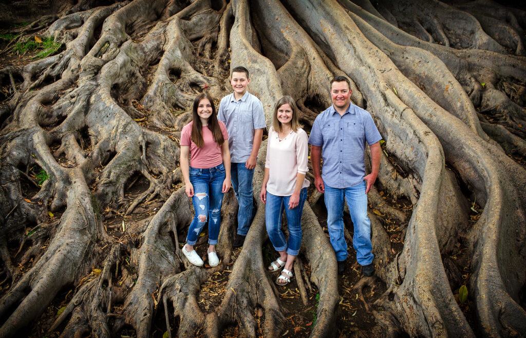 family portrait at Balboa Parks Giant Fig tree, the people love being here