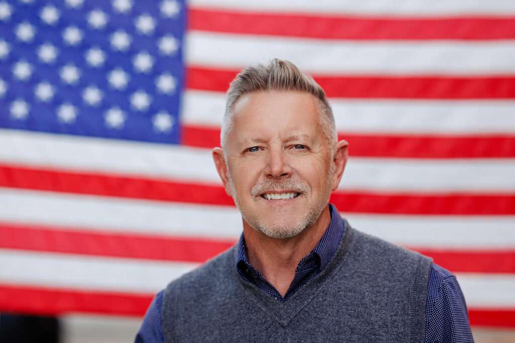 On-location headshot session in San Diego, flag background