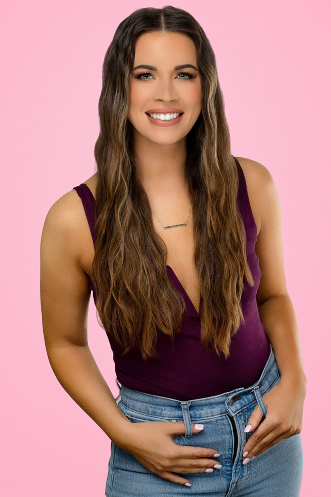 Woman in purple top and jeans